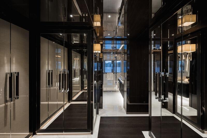 a hallway with glass doors aboard RESILIENCE Yacht for Charter
