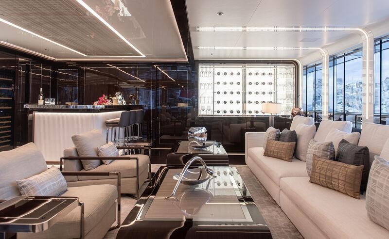 a living room with a couch and a coffee table aboard RESILIENCE Yacht for Charter