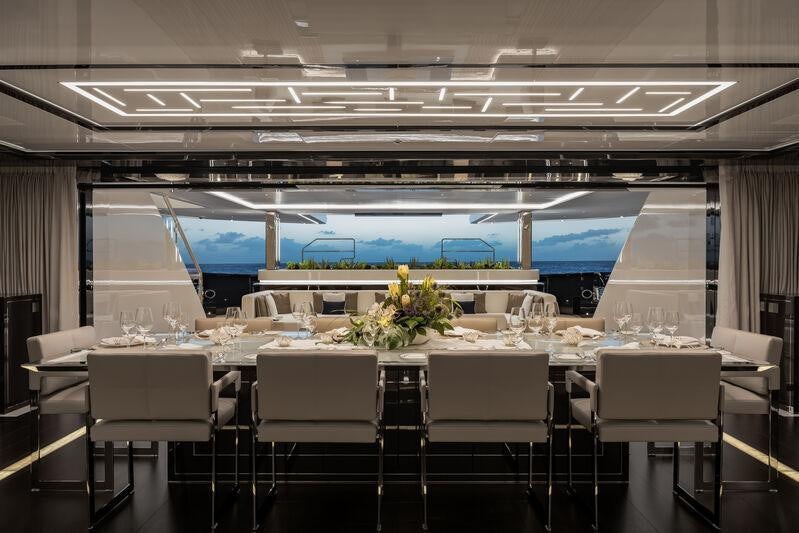 a room with a table and chairs aboard RESILIENCE Yacht for Charter