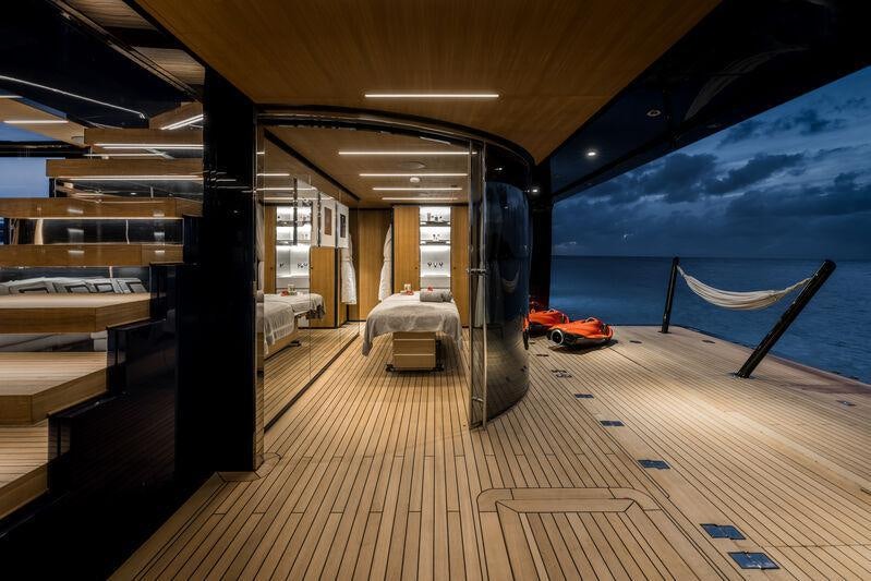 a room with a large mirror aboard RESILIENCE Yacht for Charter