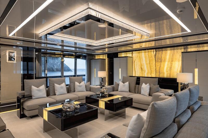 a living room with a large window aboard RESILIENCE Yacht for Charter