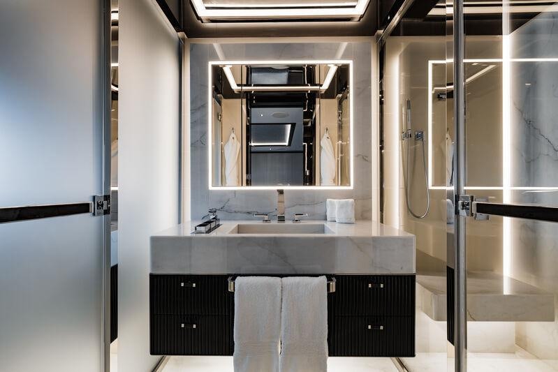 a bathroom with a sink and a mirror aboard RESILIENCE Yacht for Charter