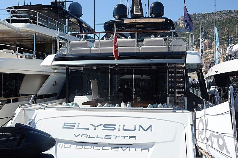 a boat with a sign on the front aboard ELYSIUM I Yacht for Charter