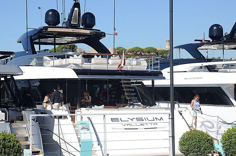 a boat with a couple of people on it aboard ELYSIUM I Yacht for Charter