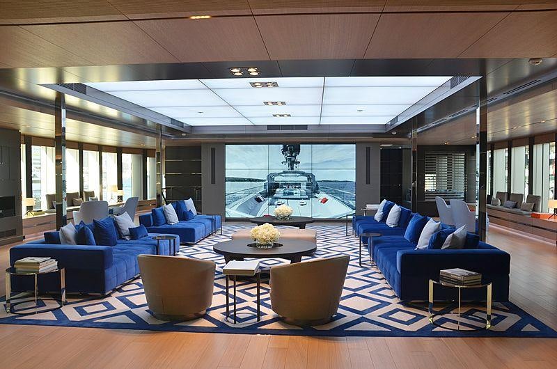 a living room with a large pool aboard BOLD Yacht for Sale