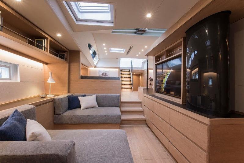 a living room with a large mirror aboard KIWAYU Yacht for Charter