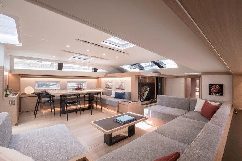 a living room with a couch and a table aboard KIWAYU Yacht for Charter