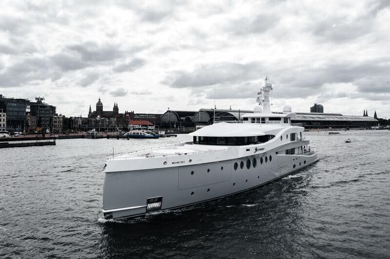 a large white boat in the water aboard STARDUST Yacht for Sale