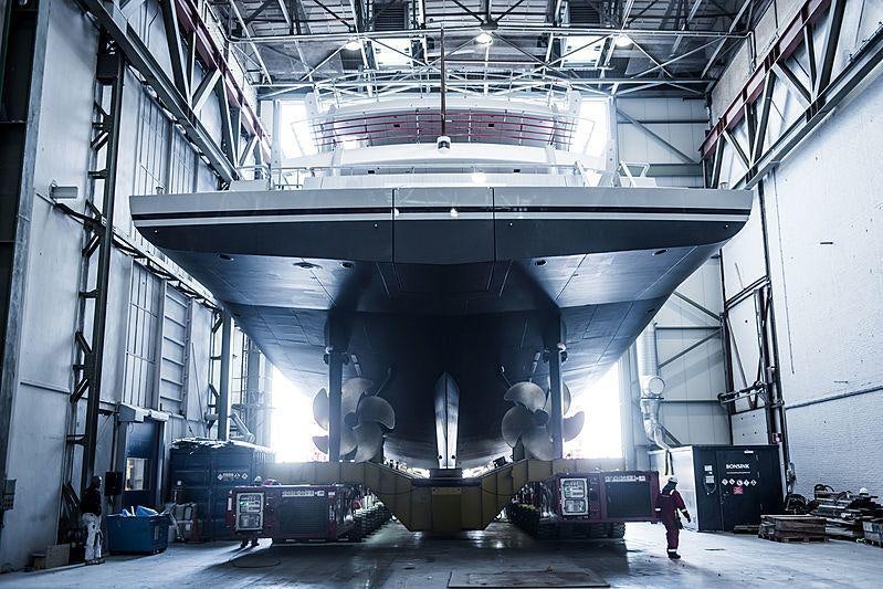 a large factory with a few people aboard STARDUST Yacht for Sale