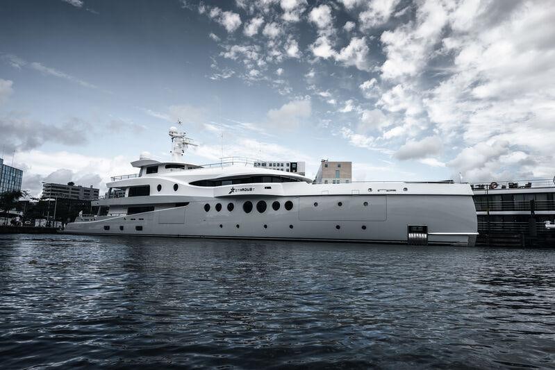 a white boat in the water aboard STARDUST Yacht for Sale