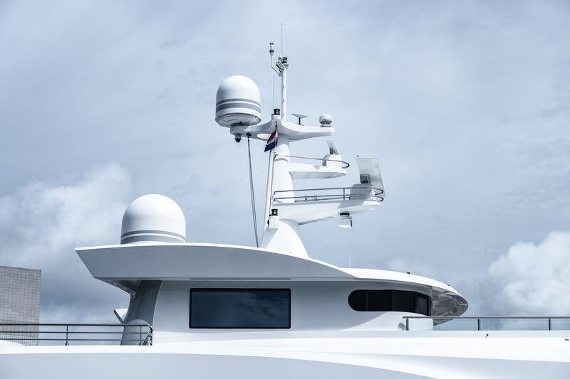 a white building with a satellite dish on top aboard STARDUST Yacht for Sale