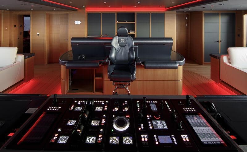 a black computer desk in a room aboard AHPO Yacht for Charter