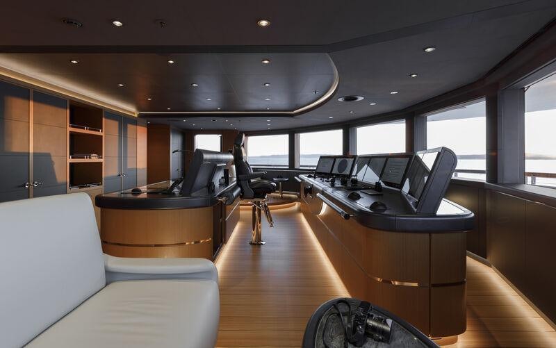 a room with a table and chairs aboard AHPO Yacht for Charter