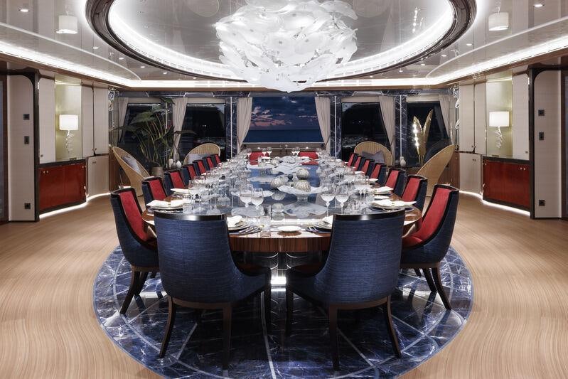 a dining room with a table and chairs aboard AHPO Yacht for Charter