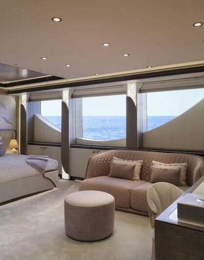 a living room with a large window aboard AHPO Yacht for Charter
