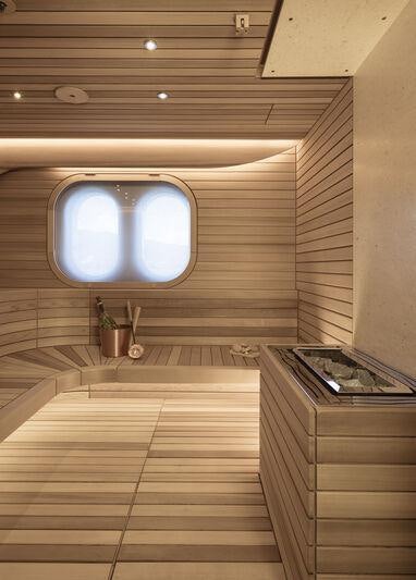 a wooden room with a large window aboard AHPO Yacht for Charter