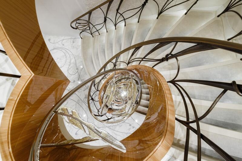 a close-up of a spiral staircase aboard AHPO Yacht for Charter