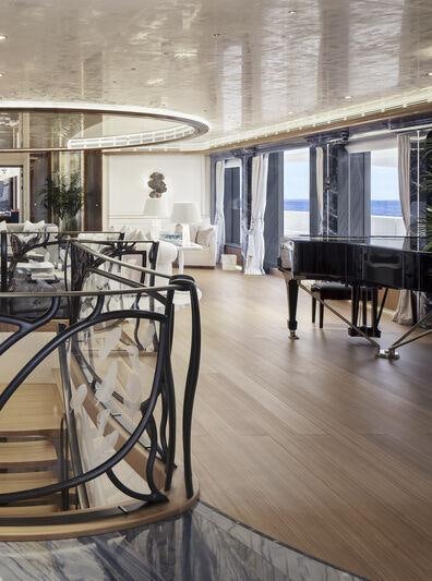 a room with a table and chairs aboard AHPO Yacht for Charter