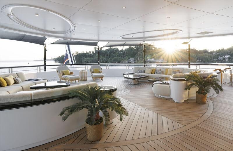 a room with a table and chairs aboard AHPO Yacht for Charter