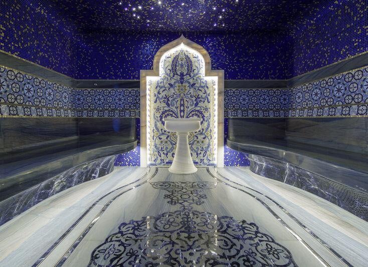 a large white statue in a room aboard AHPO Yacht for Charter