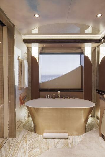 a large bathroom with a round bathtub aboard AHPO Yacht for Charter