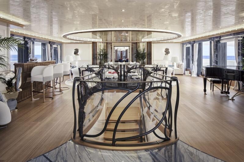 a large dining room with a table aboard AHPO Yacht for Charter
