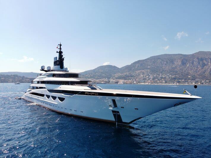a large white yacht in the water aboard AHPO Yacht for Charter