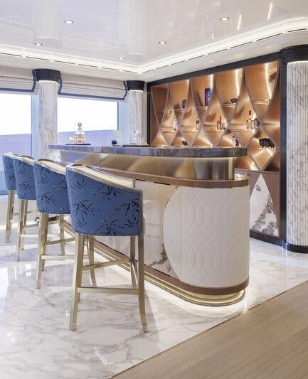 a kitchen with a large glass table aboard AHPO Yacht for Charter