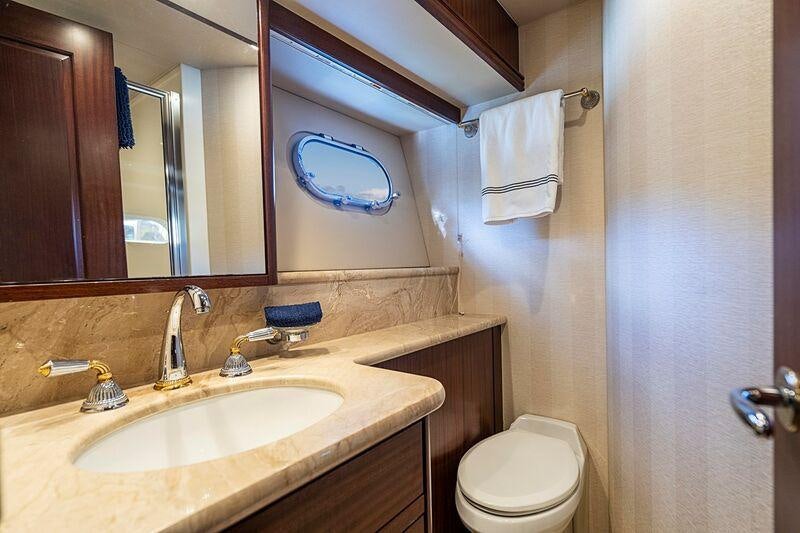 a bathroom with a toilet and a sink aboard TRANQUILITY Yacht for Charter