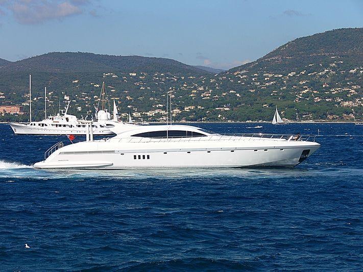 a couple of white boats in the water aboard LADY B Yacht for Charter