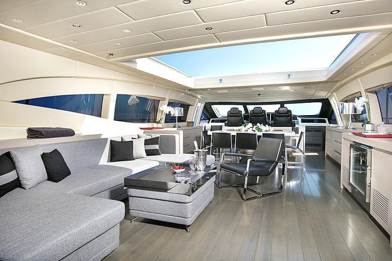 a room with a couch and a table and chairs aboard LADY B Yacht for Charter