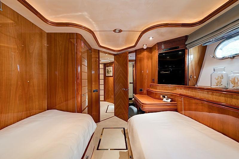 a room with a bed and a mirror aboard BABY I Yacht for Charter