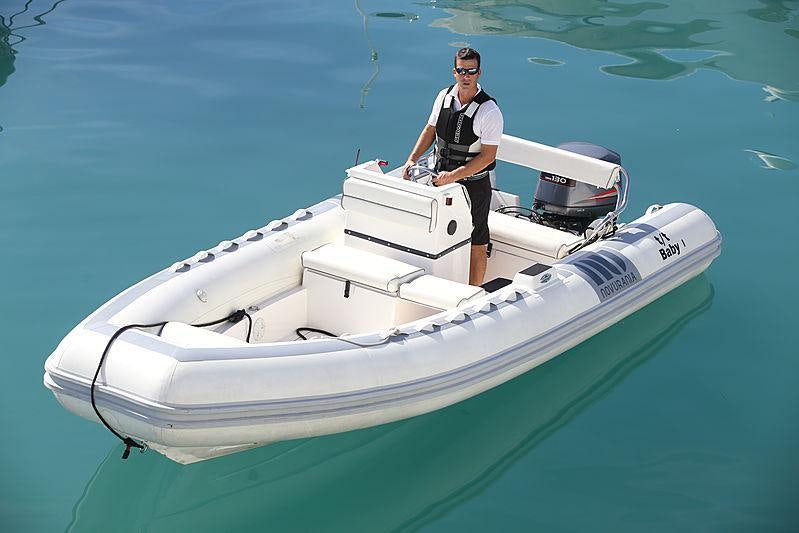 a man standing on a boat aboard BABY I Yacht for Charter