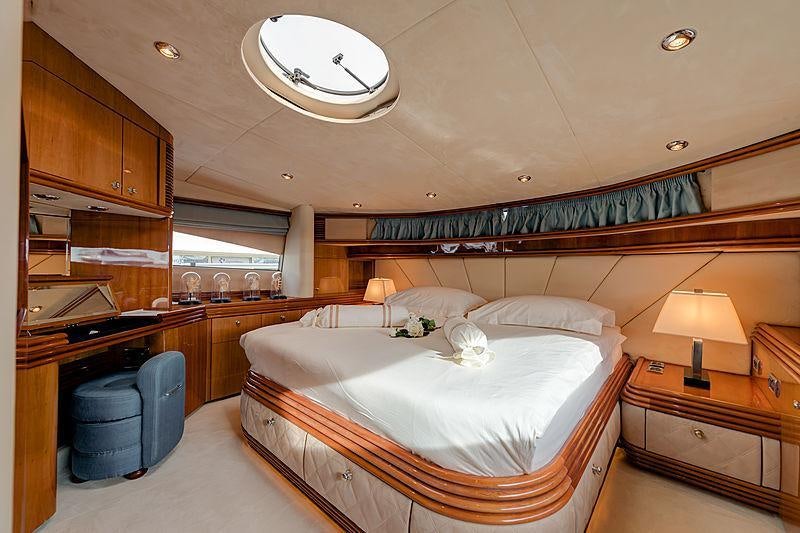 a bedroom with a large bed aboard BABY I Yacht for Charter