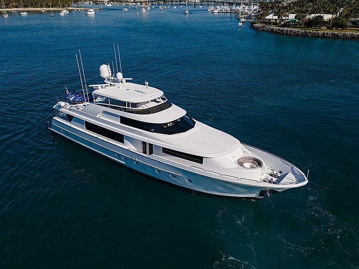 a white boat on the water aboard UNWINED Yacht for Charter