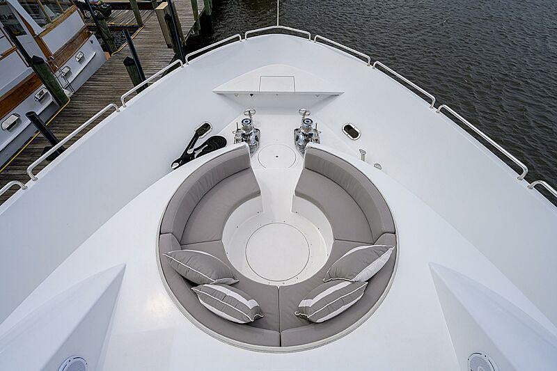 a white car with a silver emblem aboard UNWINED Yacht for Charter