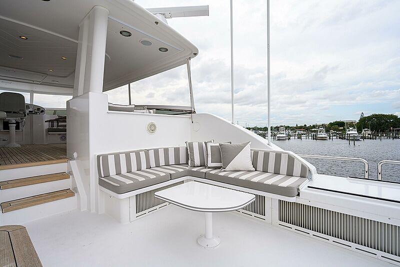 a white lounge chair on a boat aboard UNWINED Yacht for Charter