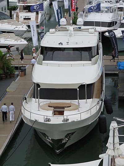a large white boat in a harbor aboard SEA N SEA Yacht for Charter