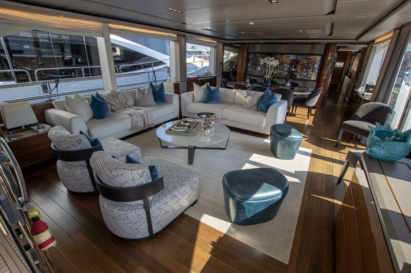 a living room with a large window aboard KOHUBA Yacht for Charter