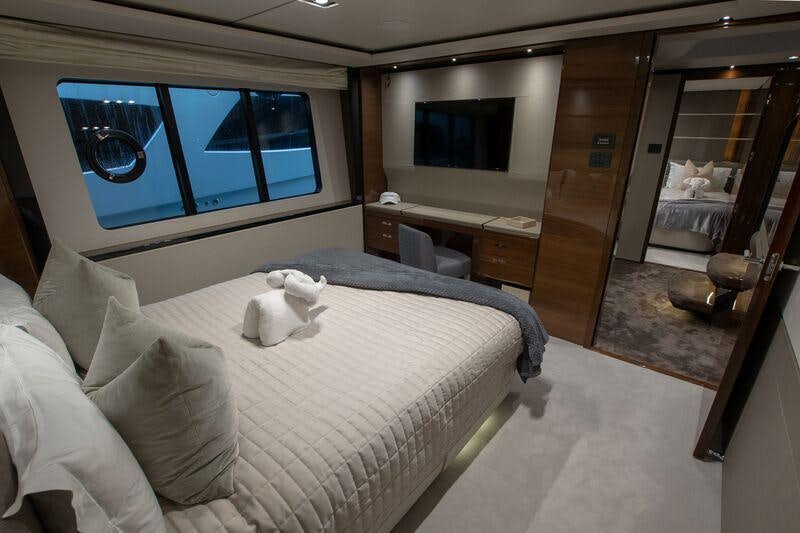 a bedroom with a large bed aboard KOHUBA Yacht for Charter