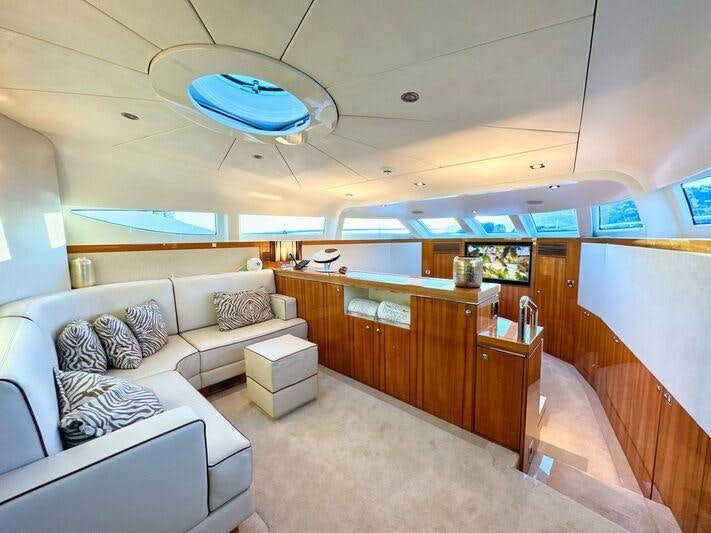 a living room with a couch and a table aboard SEA BREEZE ONE Yacht for Charter