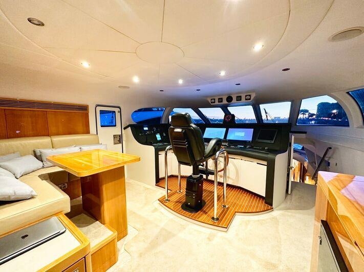 a room with a table and chairs aboard SEA BREEZE ONE Yacht for Charter