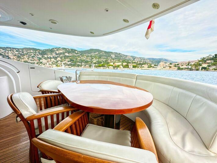 a table and chairs on a boat aboard SEA BREEZE ONE Yacht for Charter