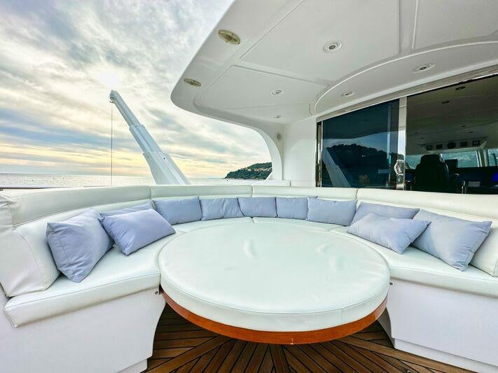 a large white bed with a large mirror above it aboard SEA BREEZE ONE Yacht for Charter