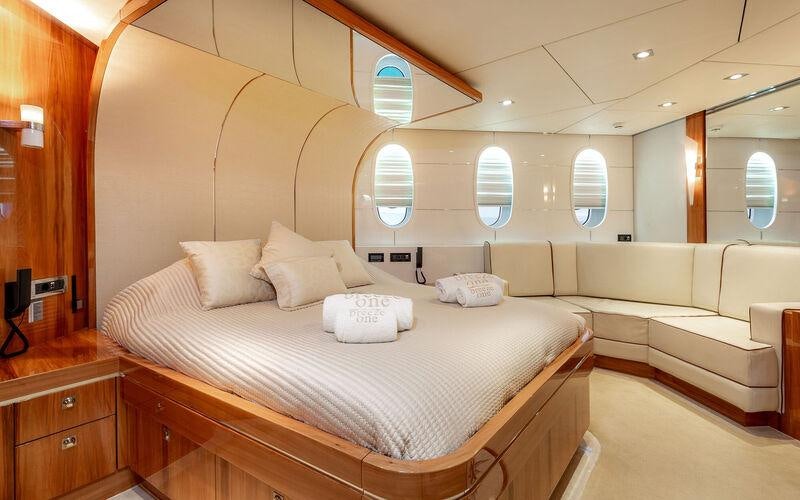 a room with a bed and a window aboard SEA BREEZE ONE Yacht for Charter