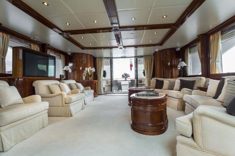 a living room with a large window aboard FRIENDSHIP Yacht for Charter