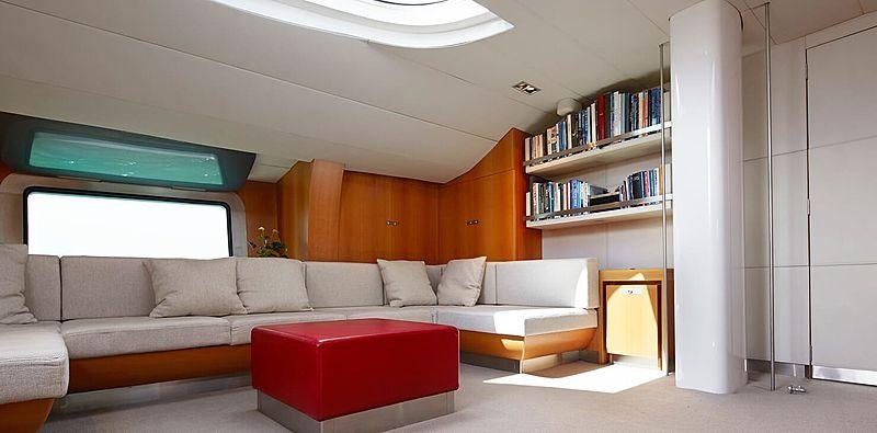 a living room with a red couch aboard SILVERTIP Yacht for Charter