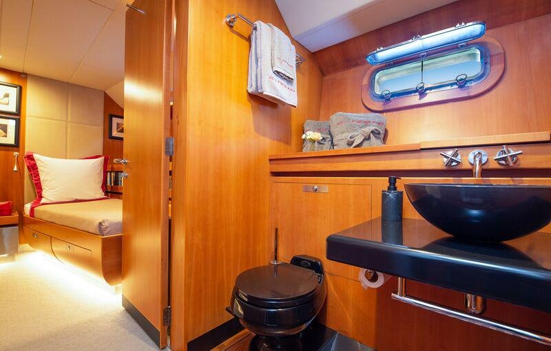a bathroom with a sink and a toilet aboard SILVERTIP Yacht for Charter