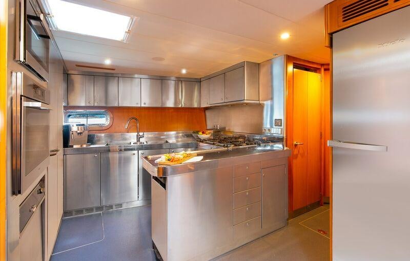 a kitchen with a large island aboard SILVERTIP Yacht for Charter