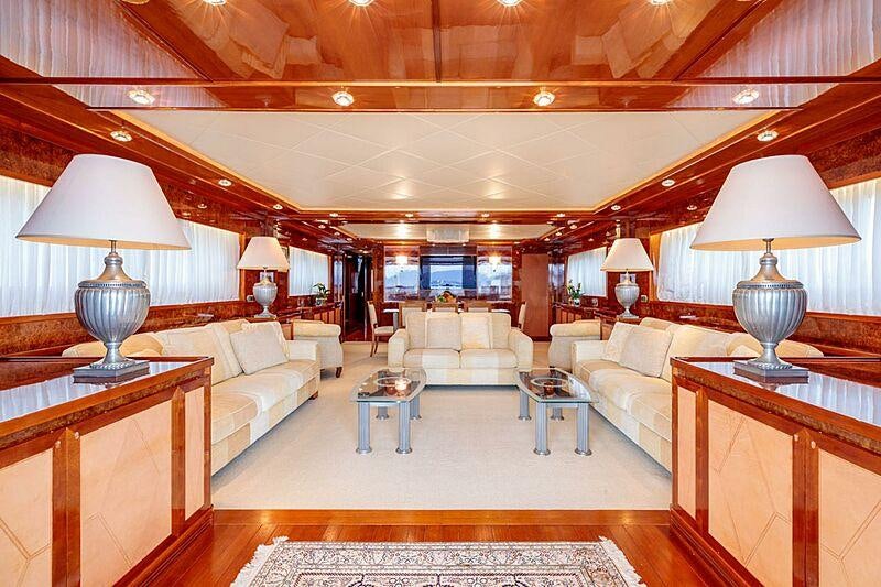a large living room with a large wood ceiling aboard OVAL Yacht for Charter